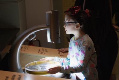 Young_visitor_looks_at_microscope_in_Dinosaur_Gallery_-_Copy.jpg