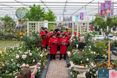 Chelsea_Pensioners_singing_in_the_Great_Pavilion._RHS_Chelsea_Flower_Show_2025_credit_RHS_-_Neil_Hepworth.jpg