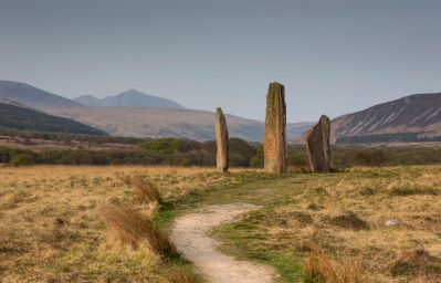 85292-machrie-standing-stones-with-goat-fell-viewed-beyond-medium_c_VisitScotland_-_Kenny_Lam.jpg