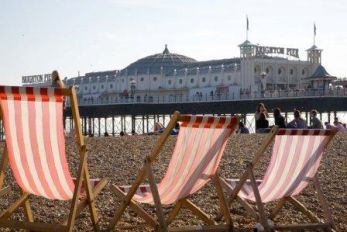 Deck_chairs_and_Brighton_Pier_c._VisitEngland_-_Andrew_Marshall.jpg